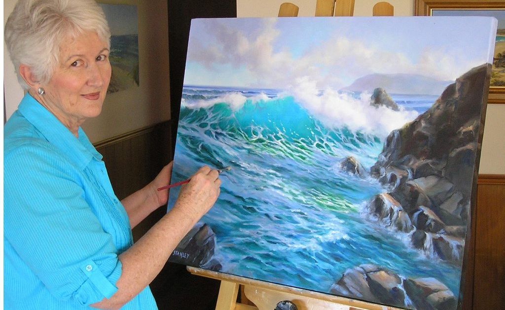 Dianne Stanley, a member of Elanora Uniting Church, with her seascape. Dianne Stanley, a member of Elanora Uniting Church, with her seascape.
